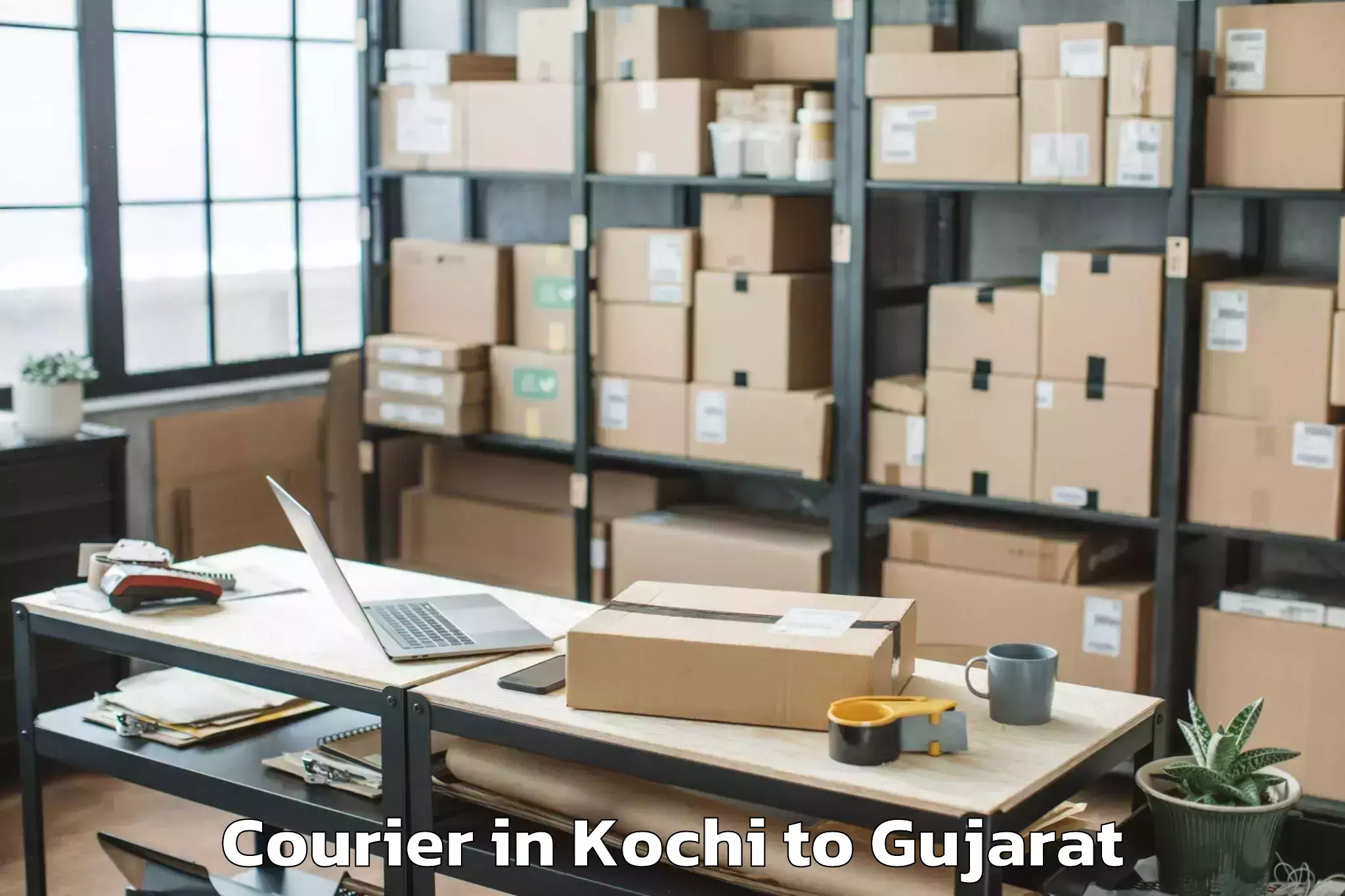 Discover Kochi to Madhavpur Courier